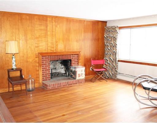 55 Bridge Street Lexington, MA 02421 - Photo 2 of 14 a living room with furniture and a fireplace