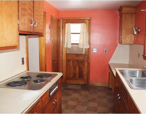 55 Bridge Street Lexington, MA 02421 - Photo 4 of 14 a kitchen with a sink stove and refrigerator
