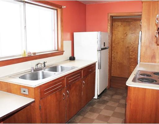 55 Bridge Street Lexington, MA 02421 - Photo 5 of 14 a kitchen with stainless steel appliances granite countertop a sink stove and refrigerator