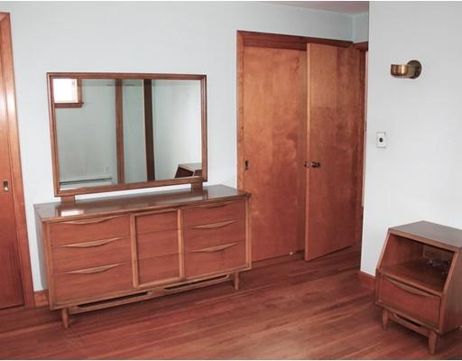55 Bridge Street Lexington, MA 02421 - Photo 6 of 14 a room with a mirror and a wooden floor