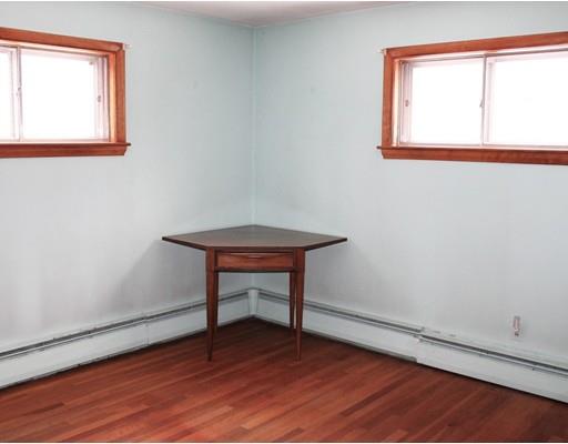 55 Bridge Street Lexington, MA 02421 - Photo 7 of 14 a room with a table and a window