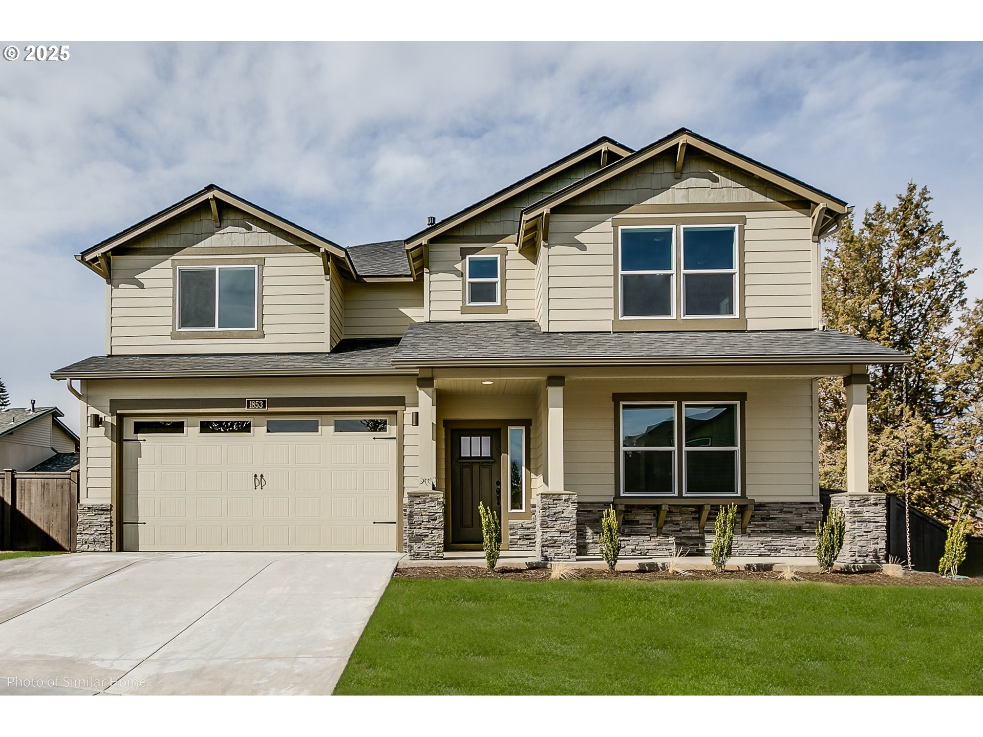 5187 Cedar View Drive Springfield, OR 97478 - Photo 1 of 1 a front view of a house with a yard and garage