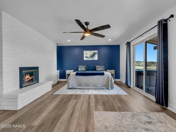 a bedroom with a large bed and a tv