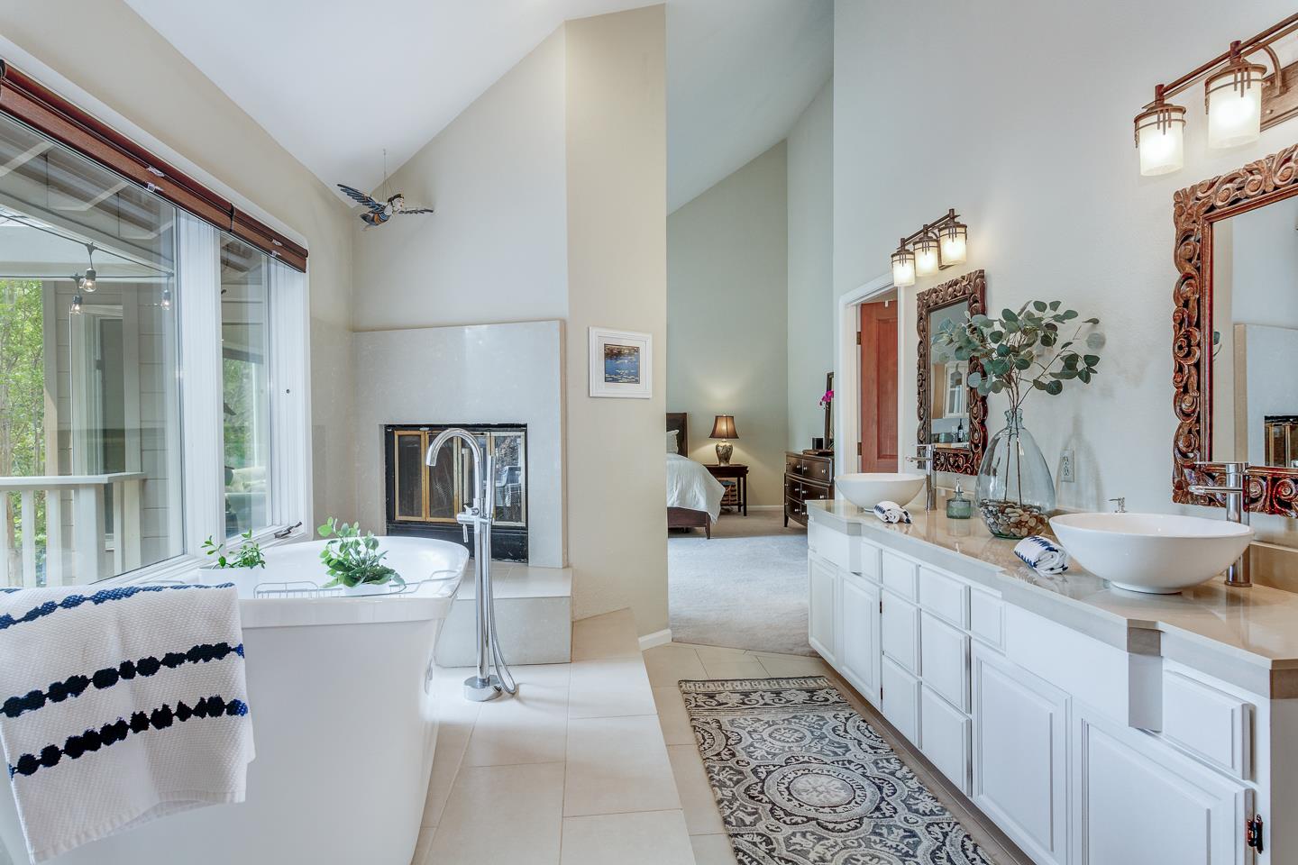 480 Hidden Valley Road Soquel, CA 95073 - Photo 16 of 72 a bathroom with a double vanity sink a mirror a potted plant and a bathtub