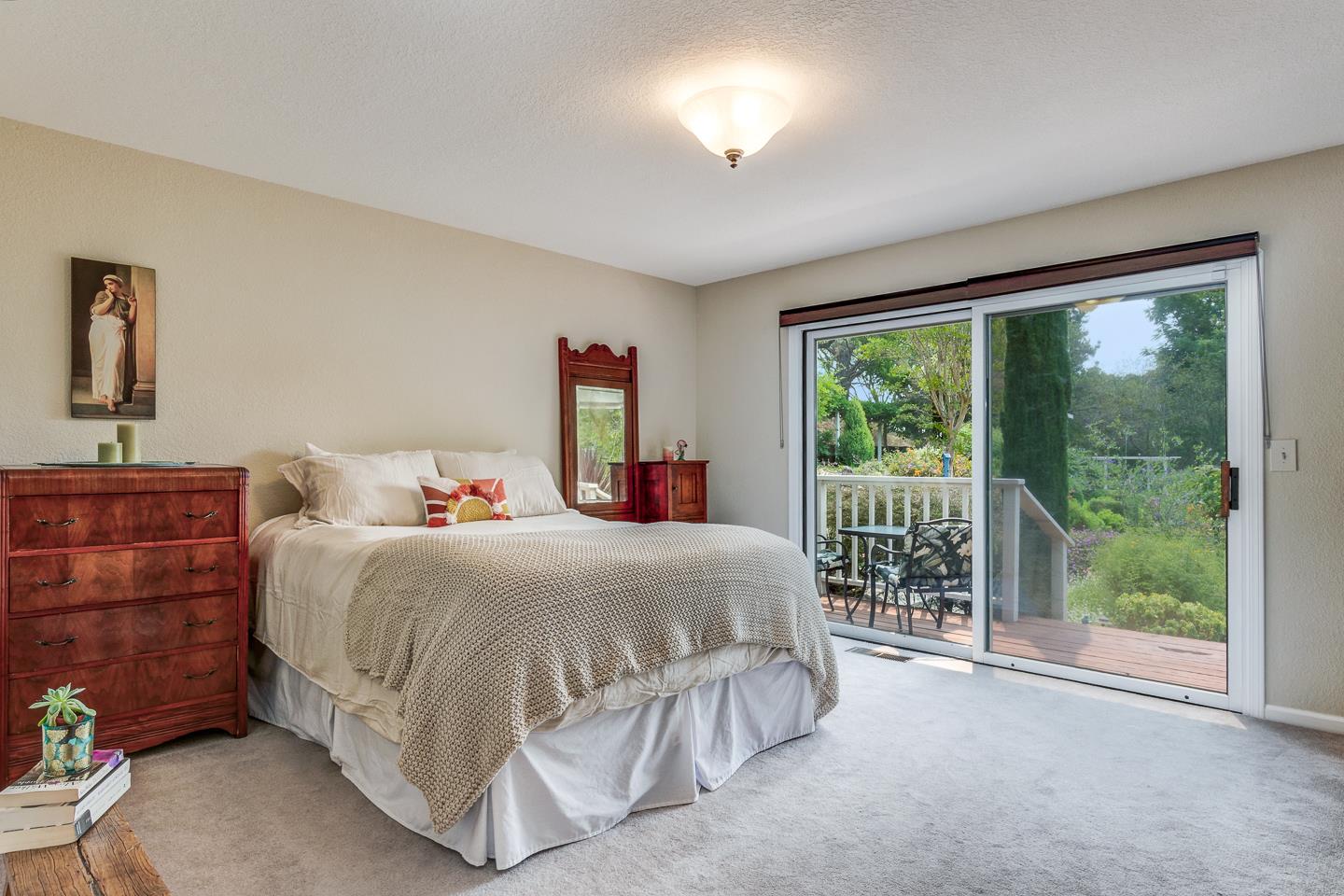 480 Hidden Valley Road Soquel, CA 95073 - Photo 24 of 72 a bedroom with a bed and a large window
