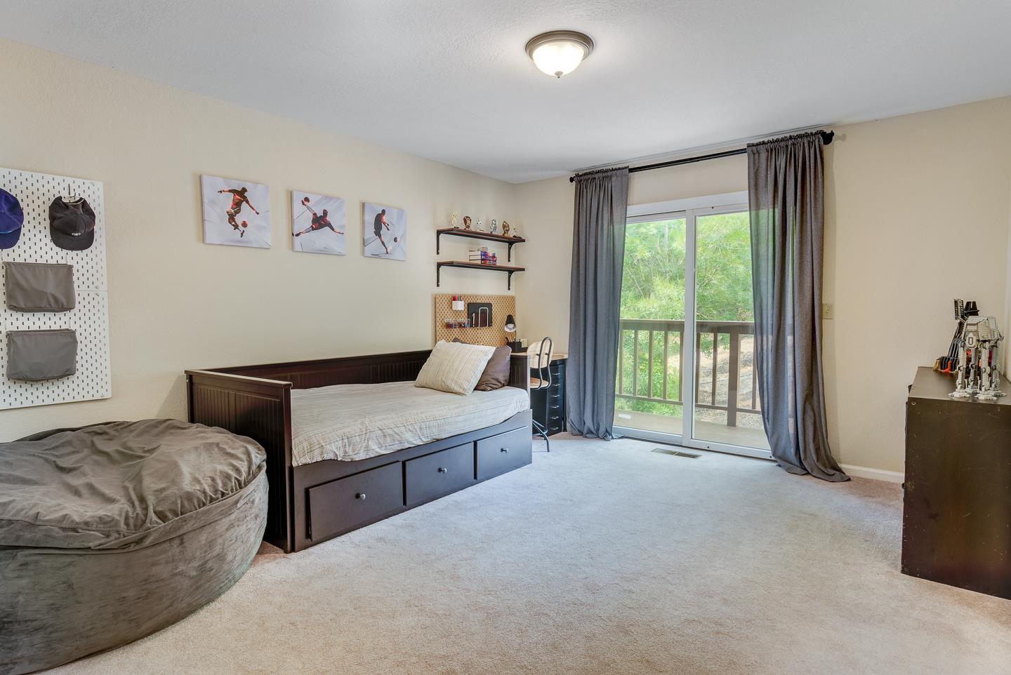 480 Hidden Valley Road Soquel, CA 95073 - Photo 25 of 72 a bedroom with a bed and a couch