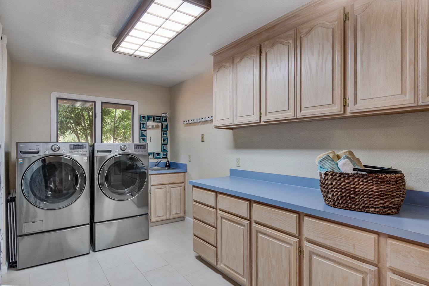480 Hidden Valley Road Soquel, CA 95073 - Photo 27 of 72 a kitchen with stainless steel appliances granite countertop a sink a stove cabinets and a window