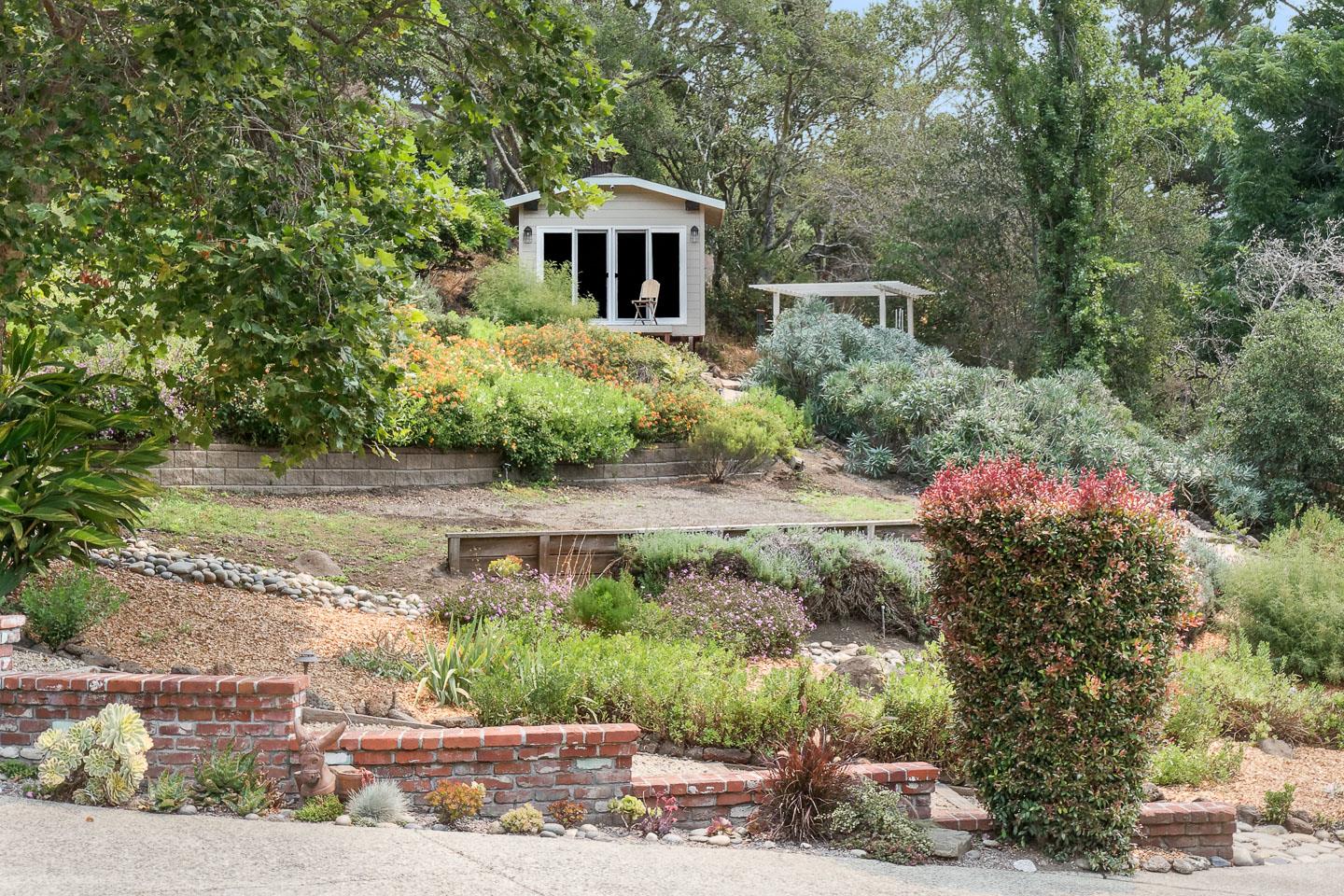 480 Hidden Valley Road Soquel, CA 95073 - Photo 30 of 72 a front view of a house with a yard