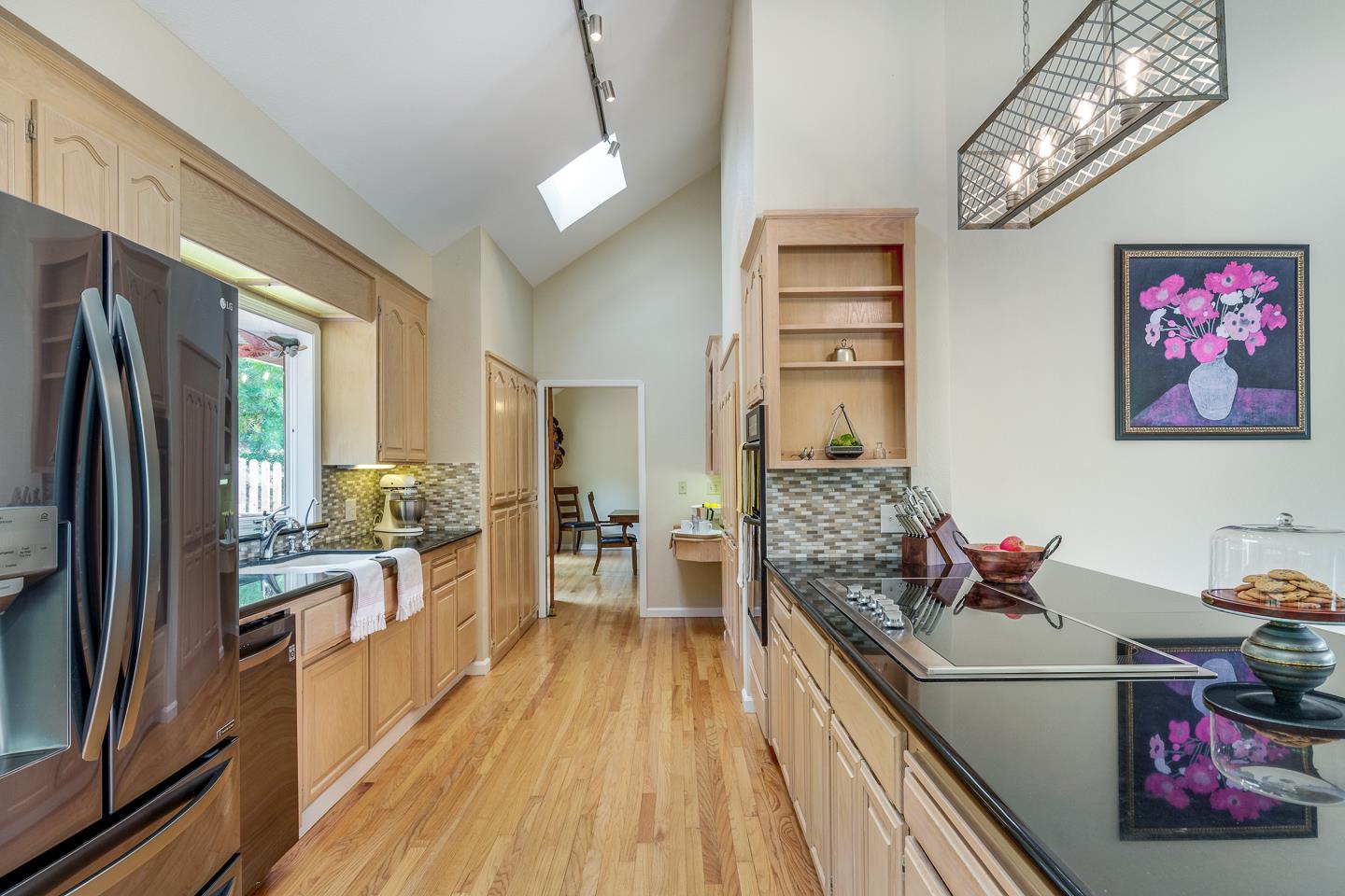 480 Hidden Valley Road Soquel, CA 95073 - Photo 10 of 72 a kitchen with stainless steel appliances granite countertop a stove oven and a refrigerator
