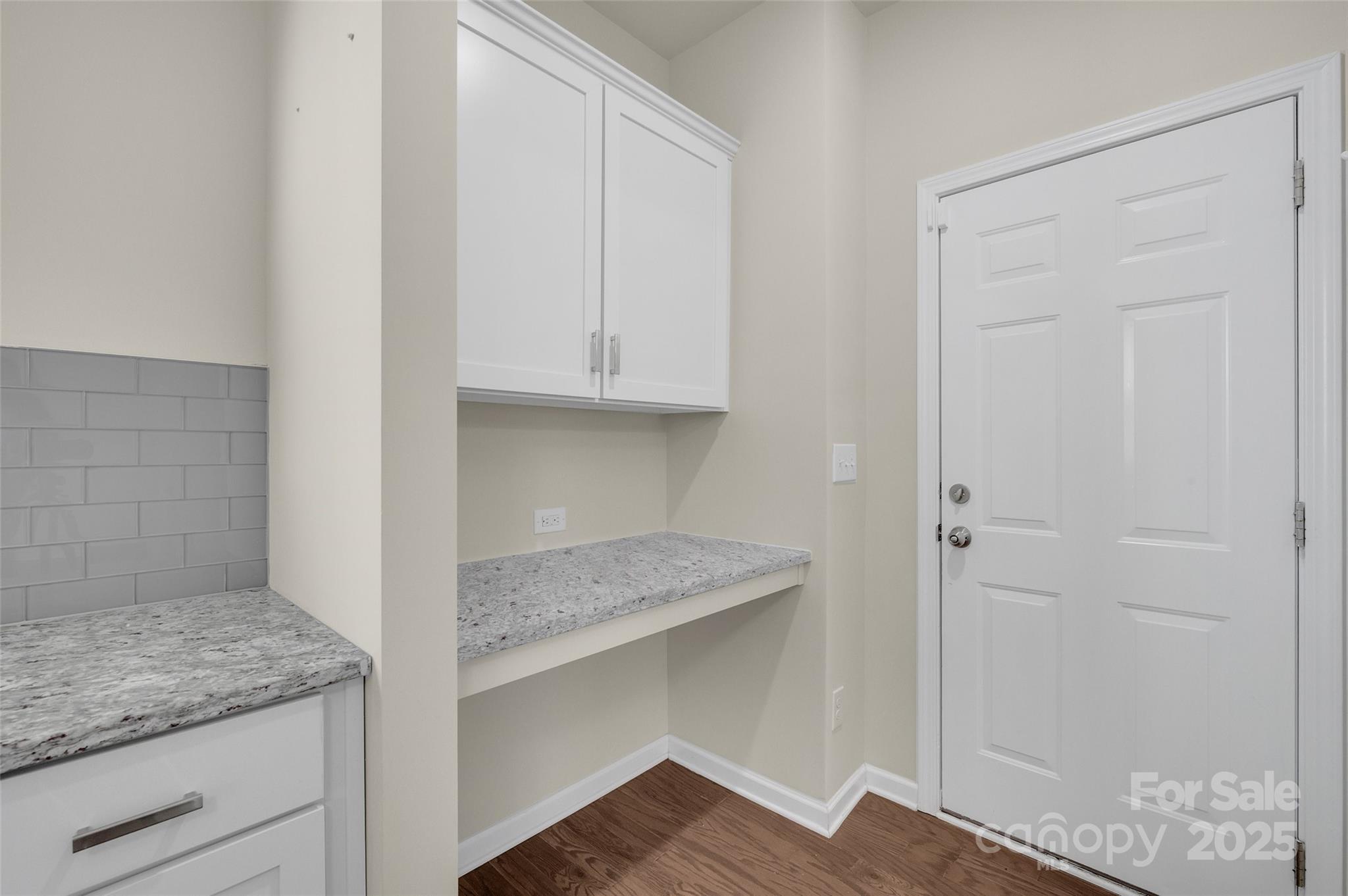 6130 Cloverdale Drive Tega Cay, SC 29708 - Photo 15 of 39 a kitchen with granite countertop white cabinets and a granite counter tops
