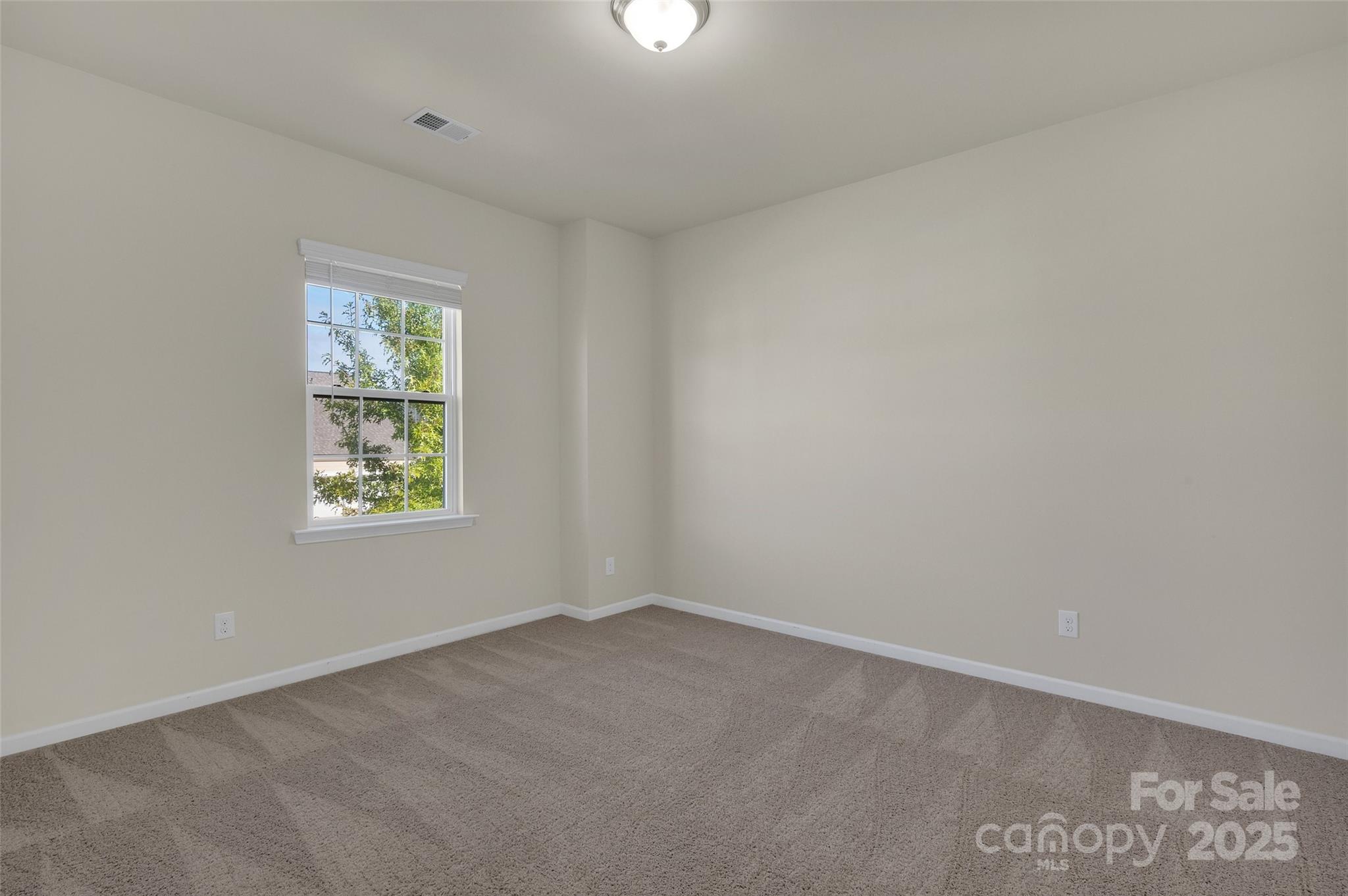 6130 Cloverdale Drive Tega Cay, SC 29708 - Photo 21 of 39 an empty room with windows