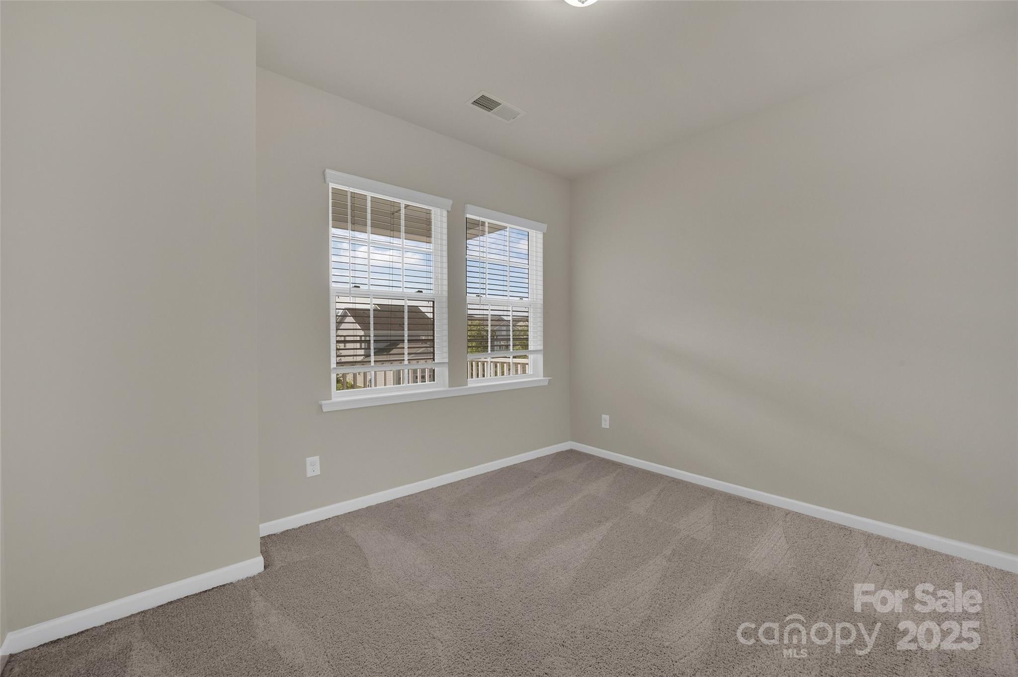 6130 Cloverdale Drive Tega Cay, SC 29708 - Photo 25 of 39 an empty room with a window