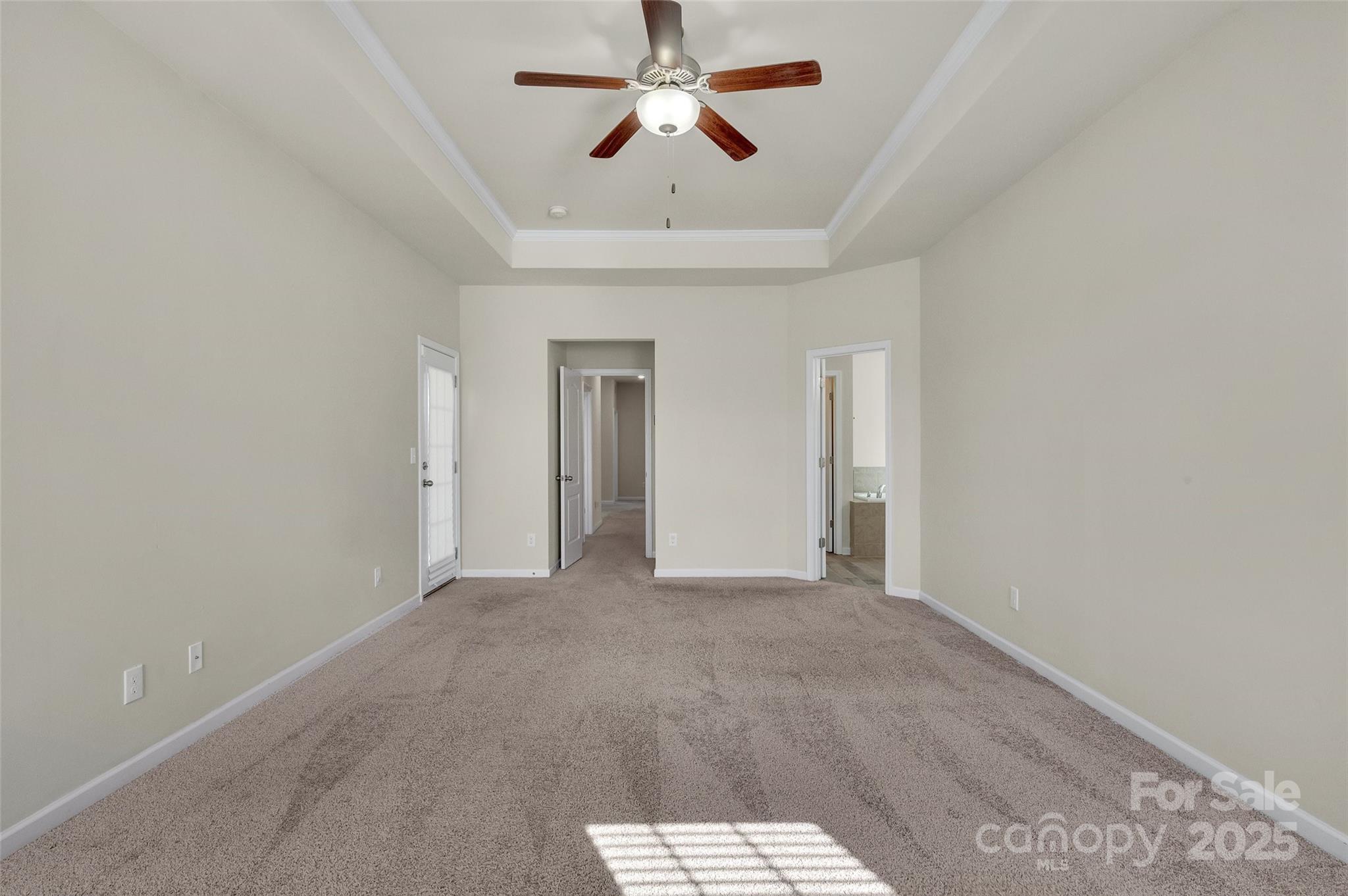 6130 Cloverdale Drive Tega Cay, SC 29708 - Photo 28 of 39 a view of a room with a ceiling fan and carpet