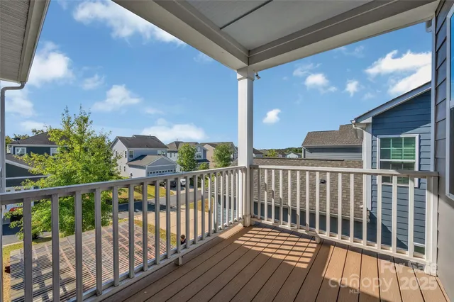 a view of a porch with a floor to ceiling window