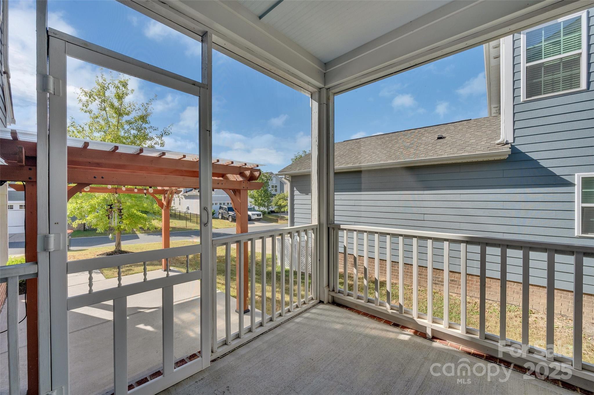 6130 Cloverdale Drive Tega Cay, SC 29708 - Photo 33 of 39 a view of a porch with a floor to ceiling window