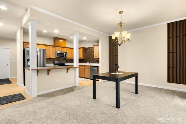 a view of kitchen with furniture and chandelier