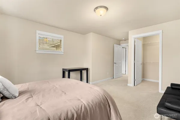 a bedroom with a bed and a view of bedroom