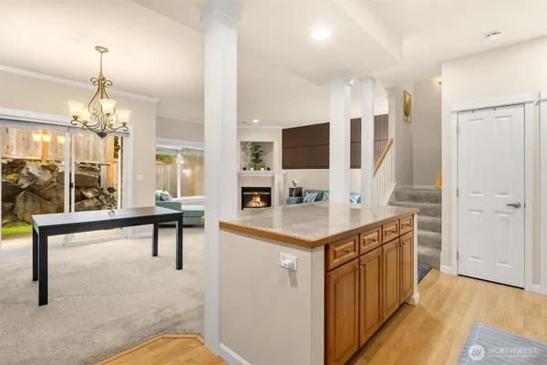 a view of living room filled with furniture and wooden floor