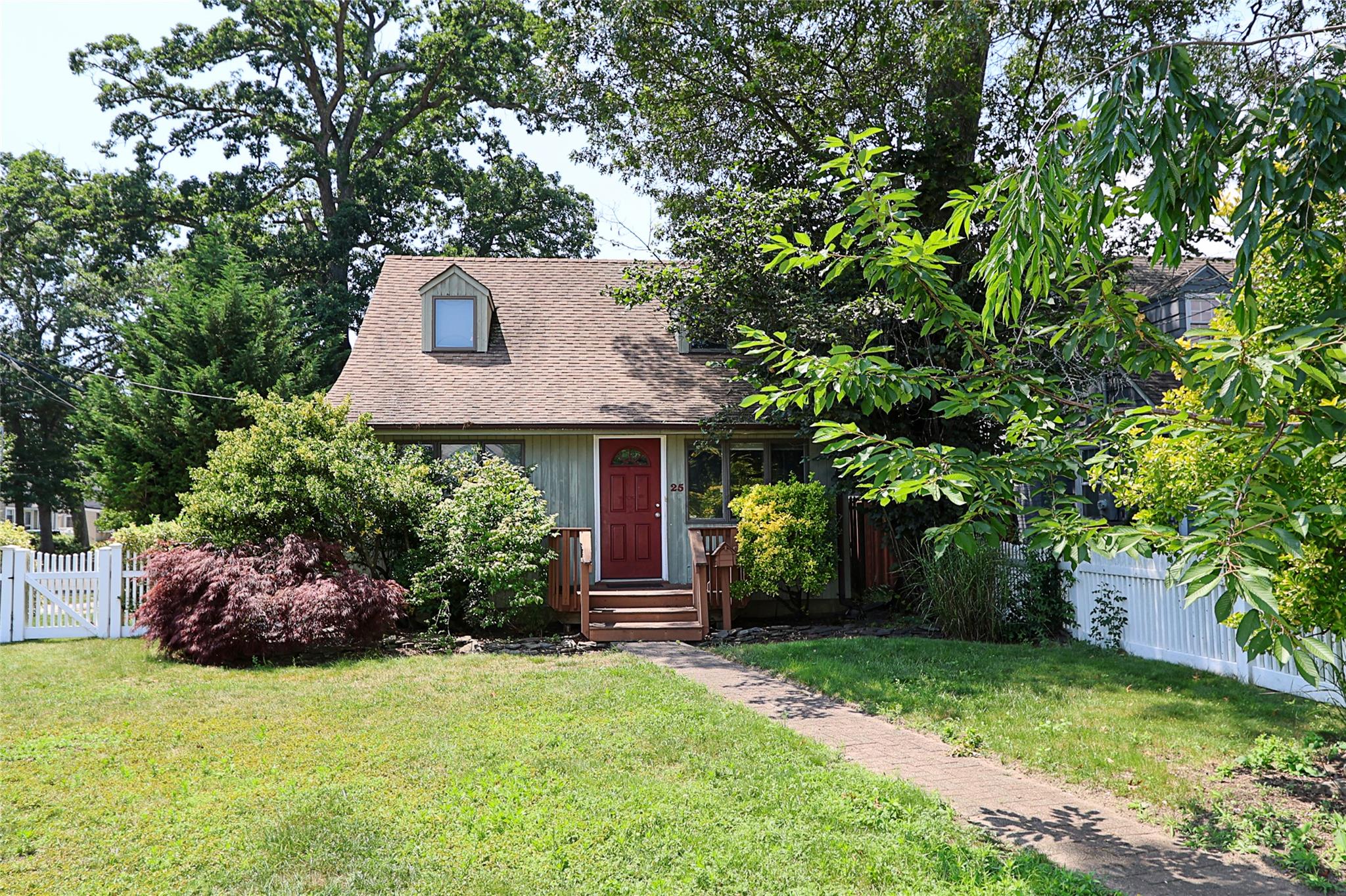 front view of a house with a yard