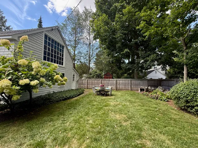a backyard of a house with lots of green space