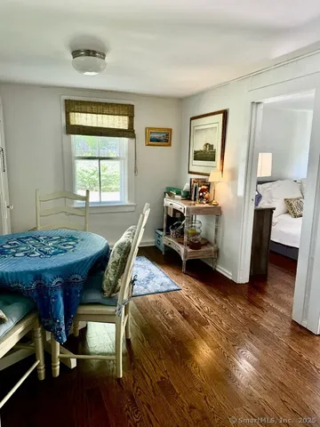 a bed room with a bed and a table