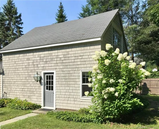 a view of a house with a tree