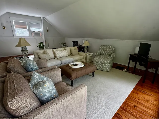 a living room with furniture and a couch