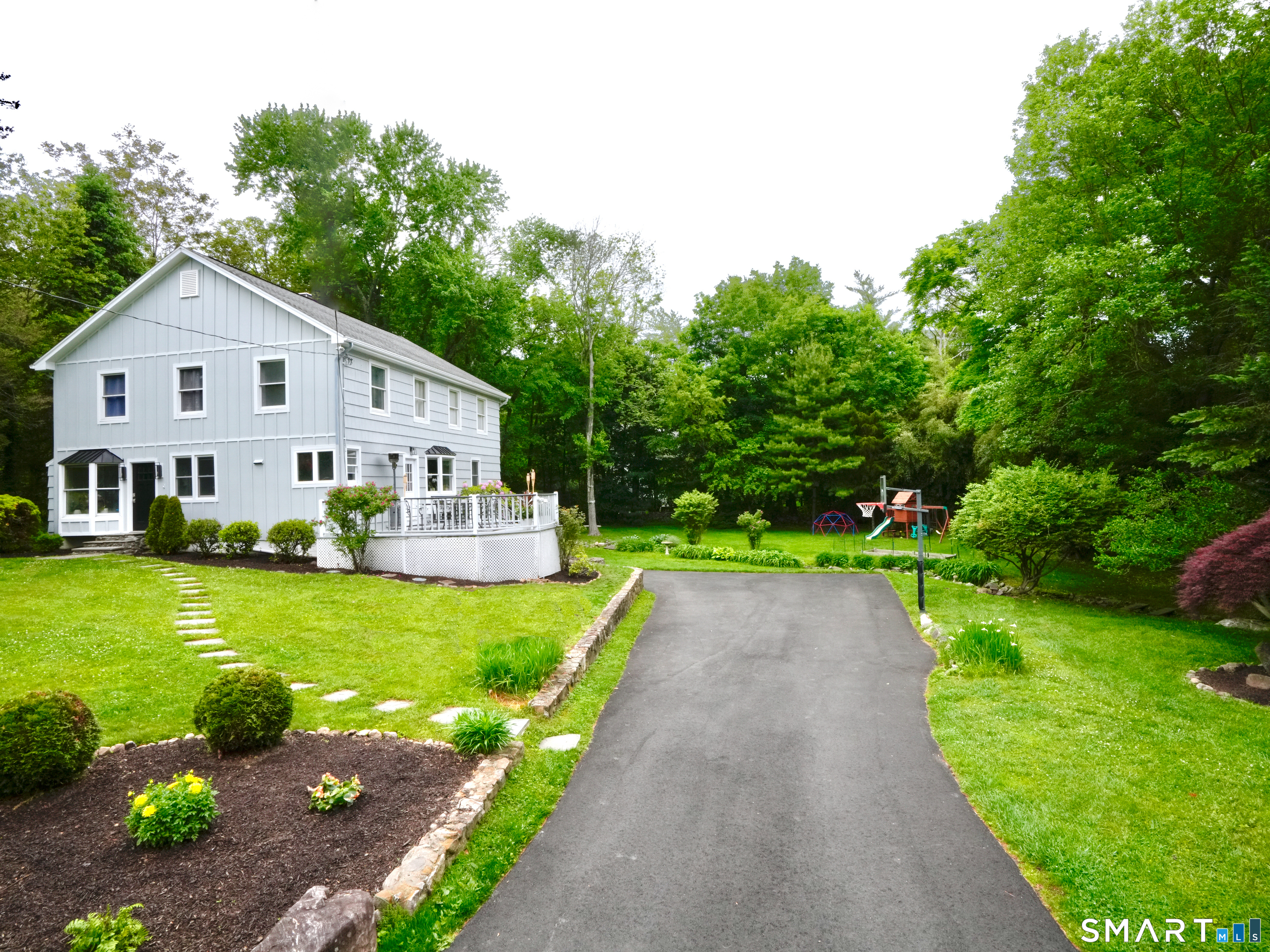 2 Rising Road Norwalk, CT 06850 - Photo 32 of 33 a view of a house with a yard and a garden