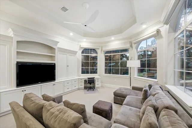 a kitchen with stainless steel appliances granite countertop a stove and a white cabinets