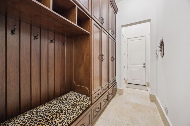 a bed room with a bed window and a flat screen tv