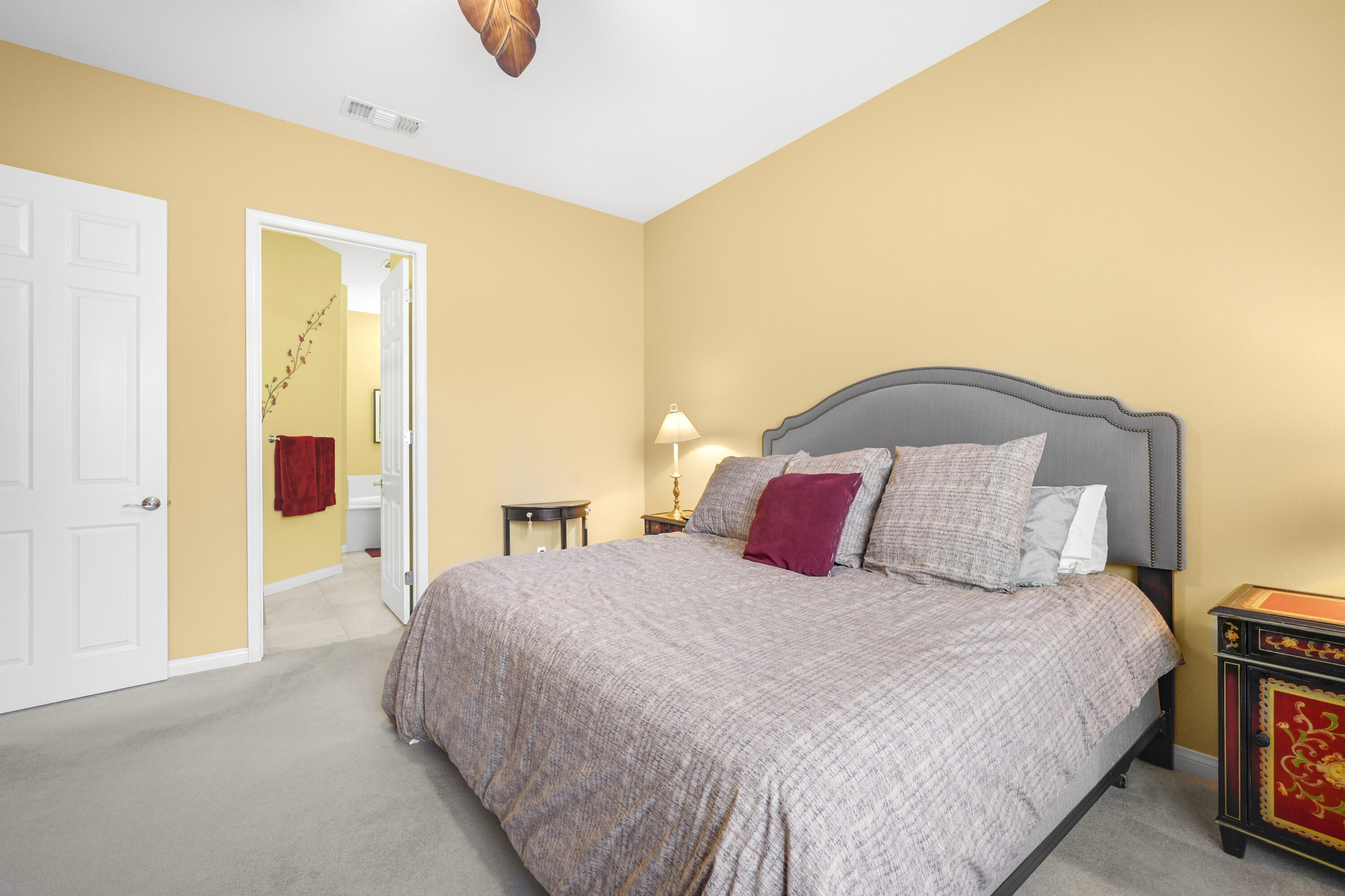 40267 Calle Ebano Indio, CA 92203 - Photo 14 of 48 a bedroom with a large bed and a potted plant