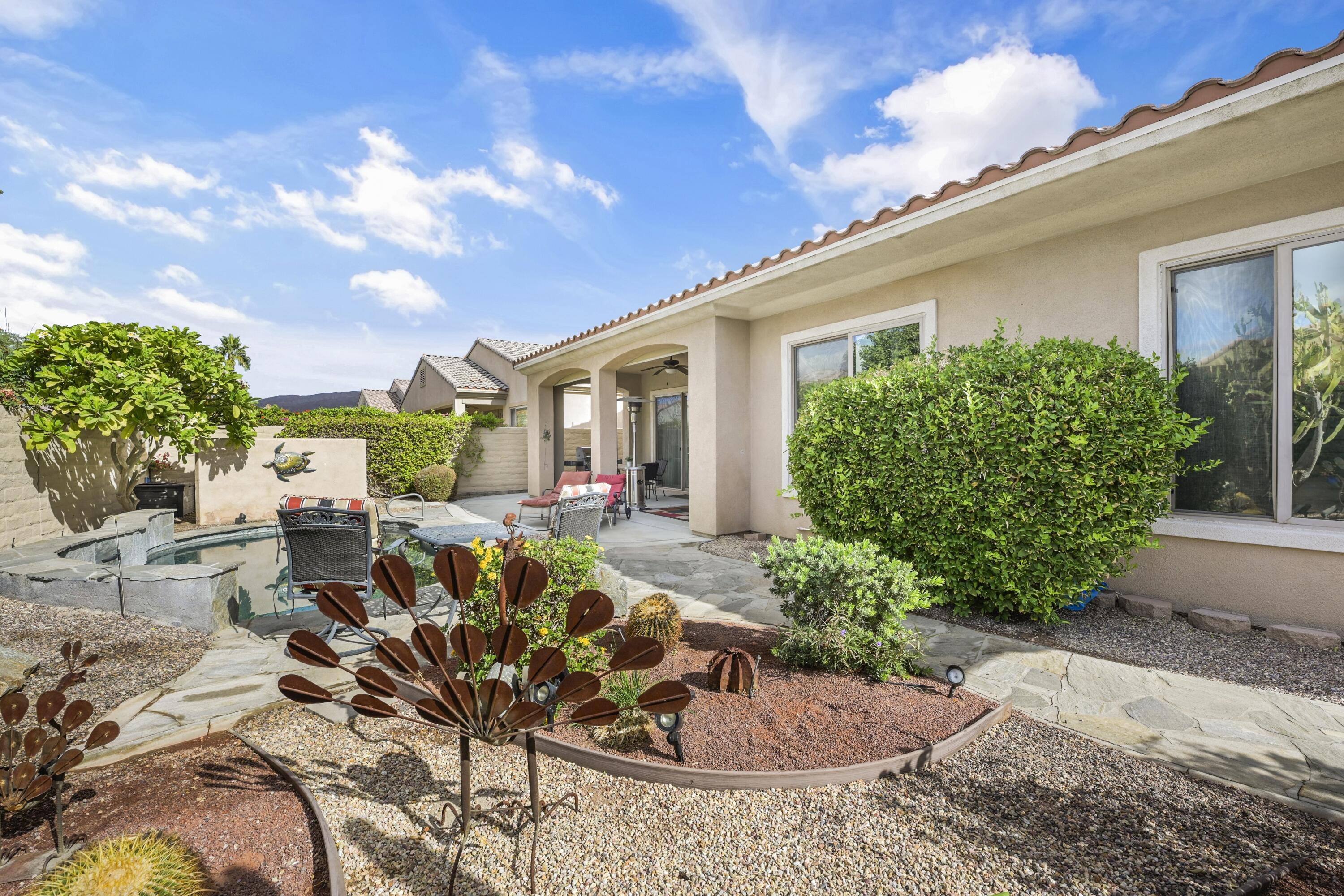 40267 Calle Ebano Indio, CA 92203 - Photo 29 of 48 a view of a house with backyard sitting area and garden