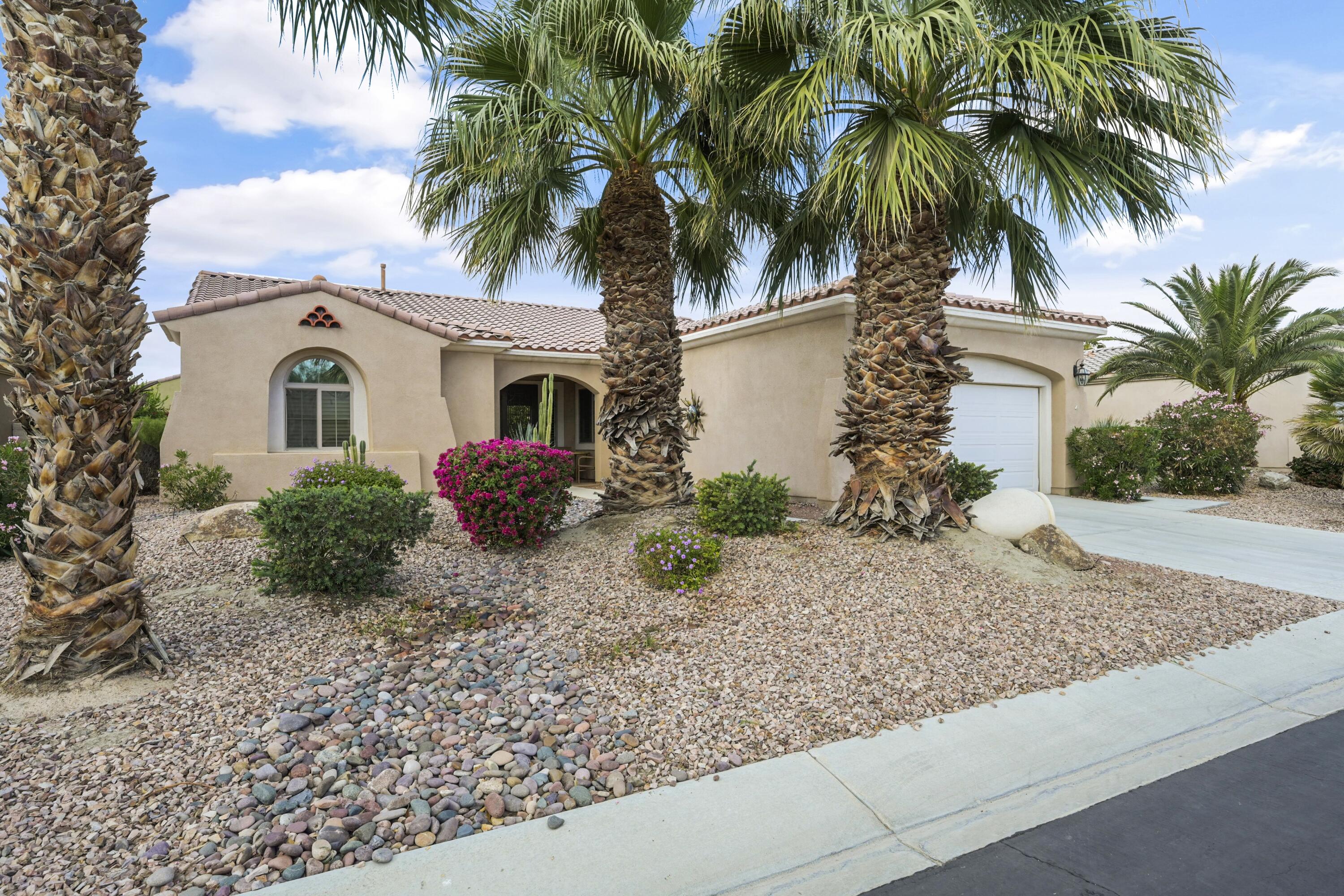 40267 Calle Ebano Indio, CA 92203 - Photo 31 of 48 a front view of a house with balcony plants and palm tree