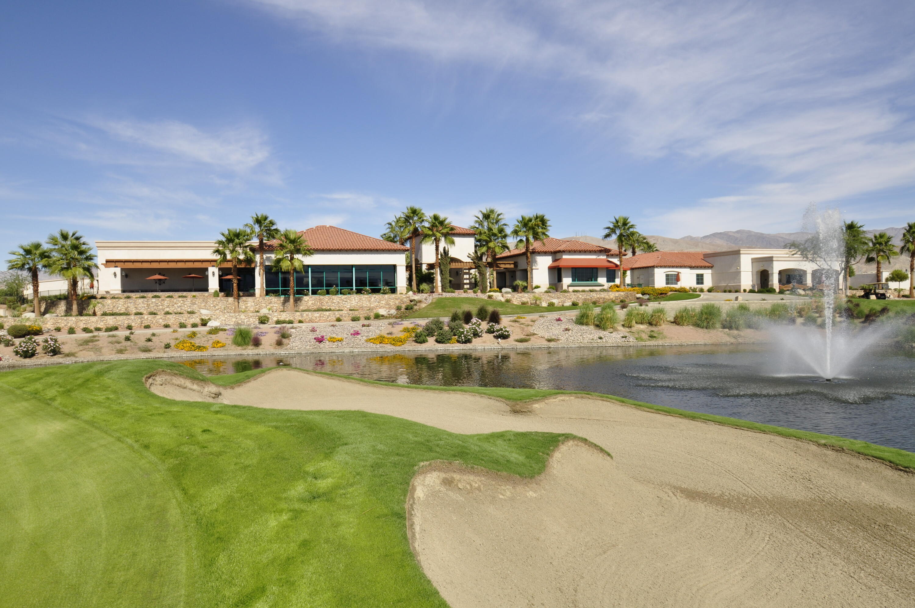 40267 Calle Ebano Indio, CA 92203 - Photo 38 of 48 a view of a lake with a building and wooden floor