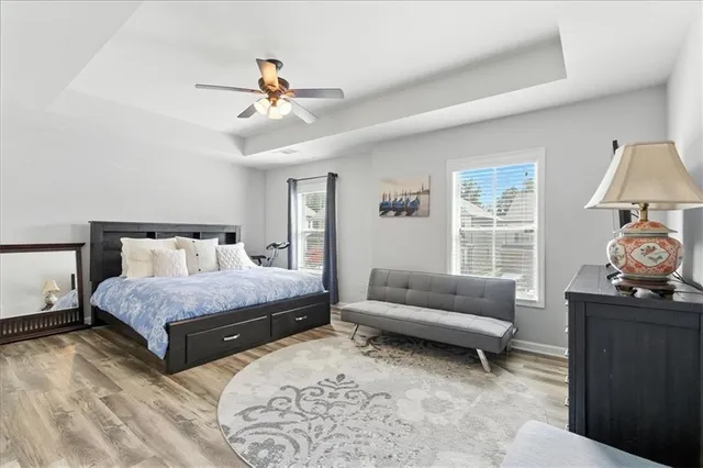 a spacious bedroom with a bed and a couch