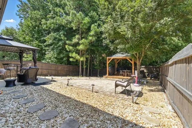 a view of a backyard with a sitting area