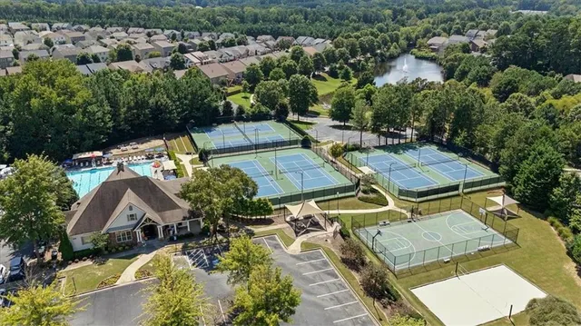 an aerial view of residential houses with outdoor space