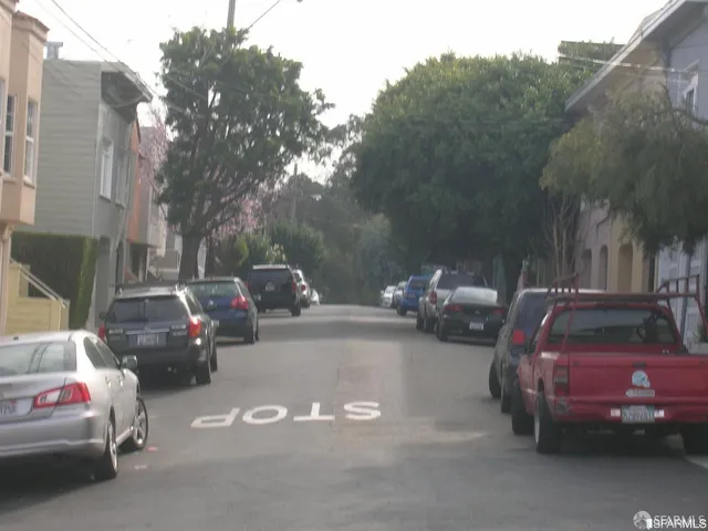 a view of a cars in front of a house