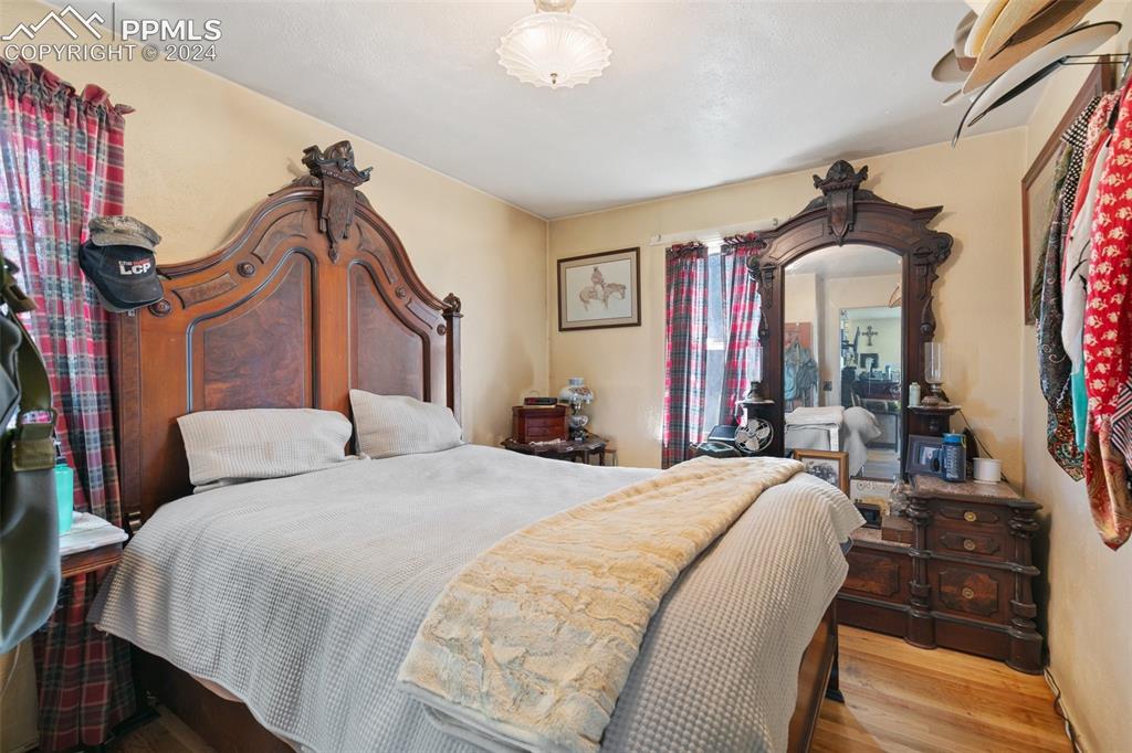 40150 Rapp Road Rush, CO 80833 - Photo 12 of 39 a bed room with a bed and a chandelier