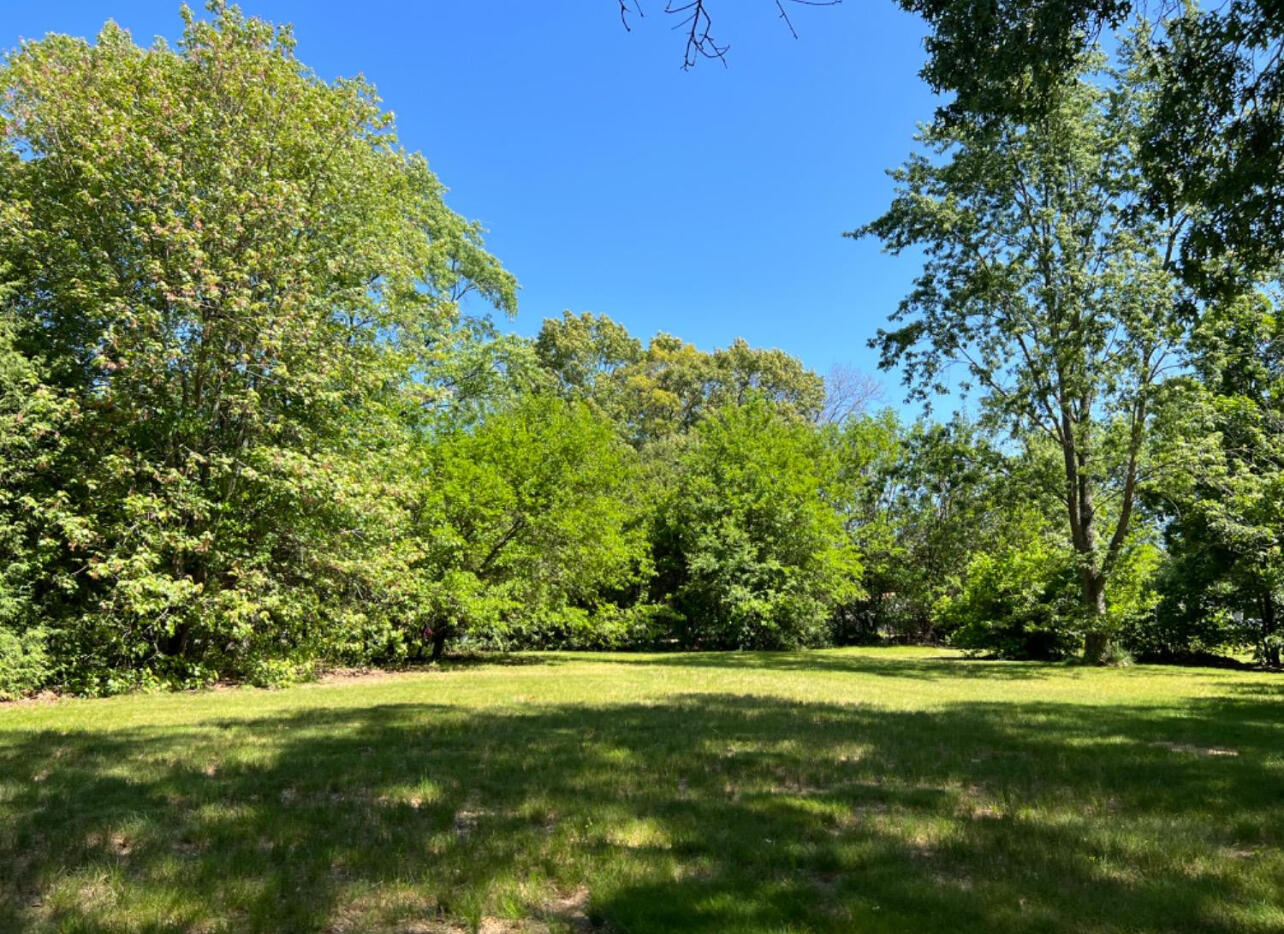 a view of a golf course with a yard