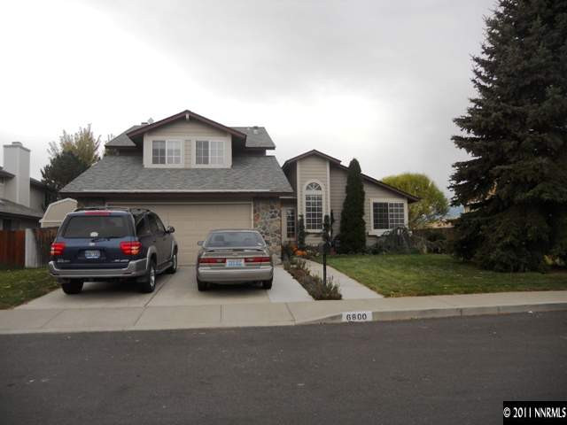 6800 Chesterfield Lane Reno, NV 89523 - Photo 1 of 1 a couple of cars parked in front of a house