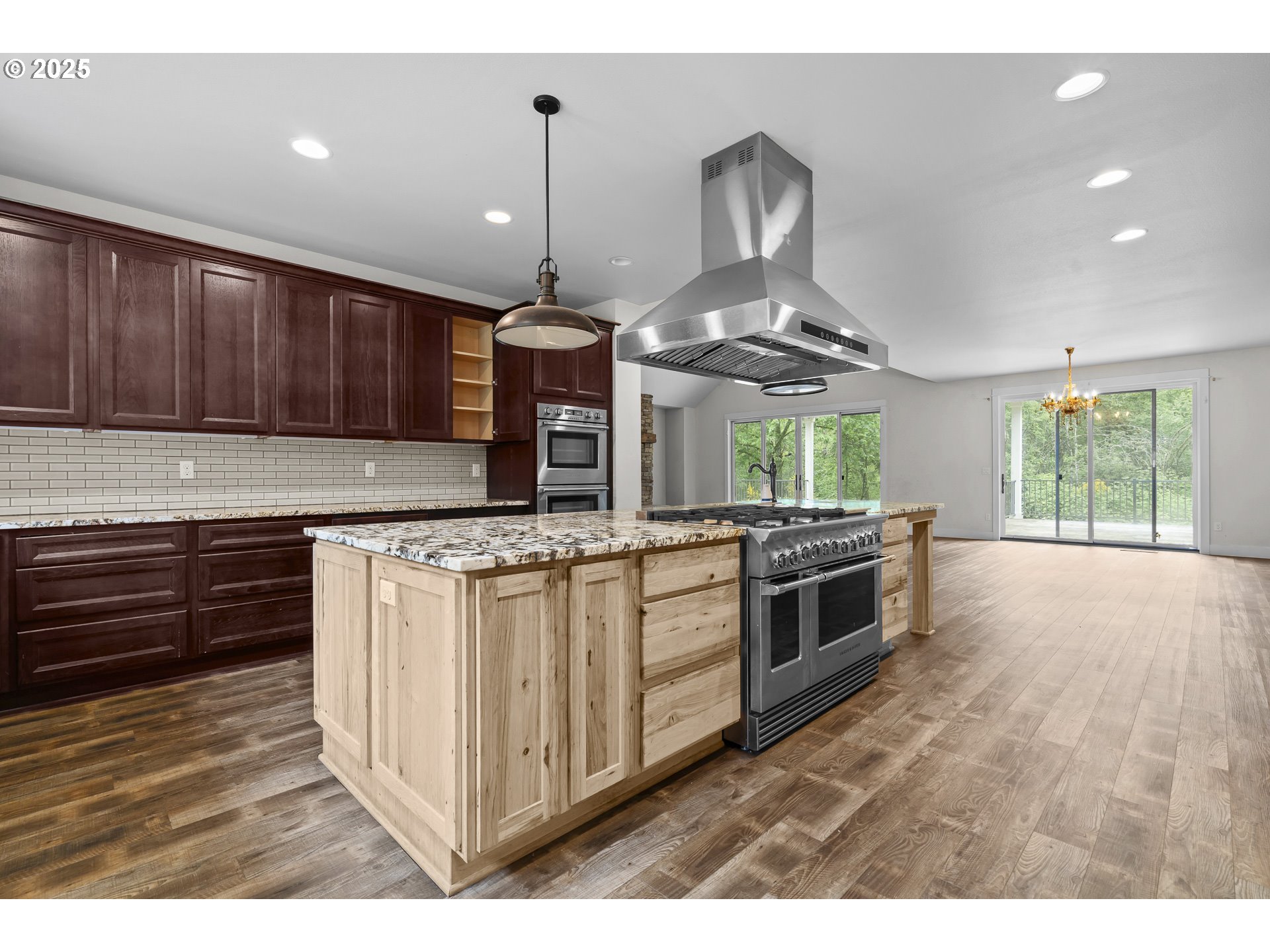 39665 Southeast Rude Road Sandy, OR 97055 - Photo 11 of 48 a kitchen with stainless steel appliances granite countertop a stove a sink and a refrigerator