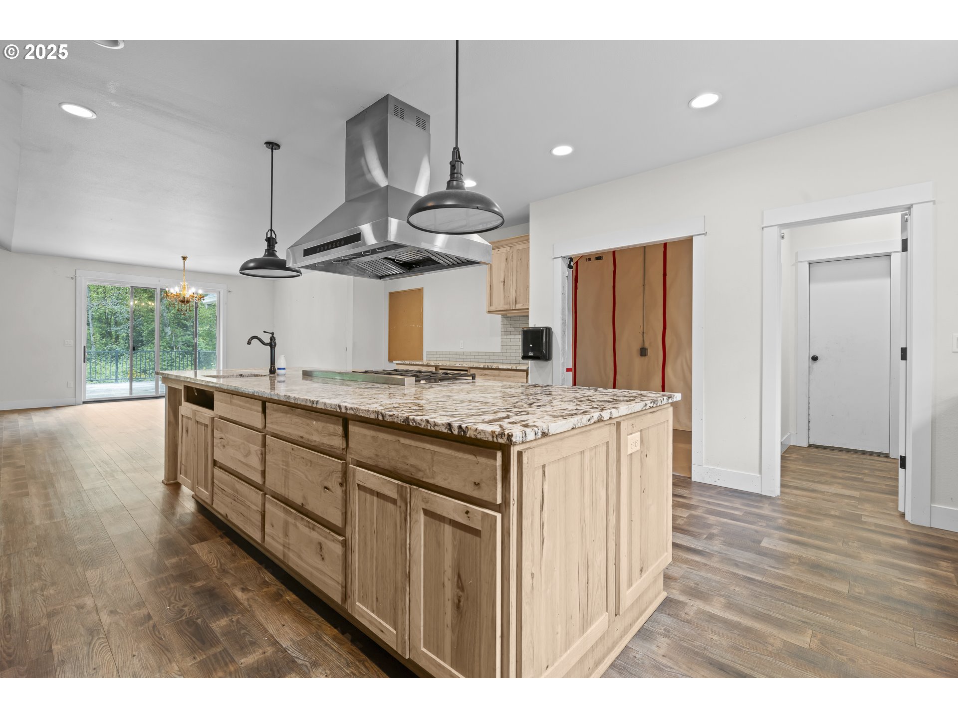 39665 Southeast Rude Road Sandy, OR 97055 - Photo 13 of 48 a kitchen with stainless steel appliances granite countertop a stove and a wooden floors