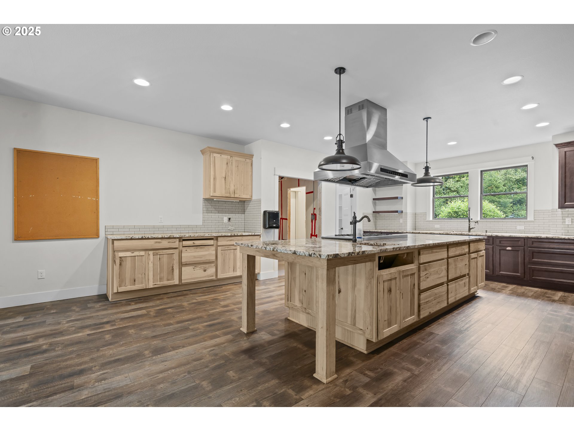 39665 Southeast Rude Road Sandy, OR 97055 - Photo 16 of 48 a kitchen with stainless steel appliances granite countertop a sink stove and wooden floor