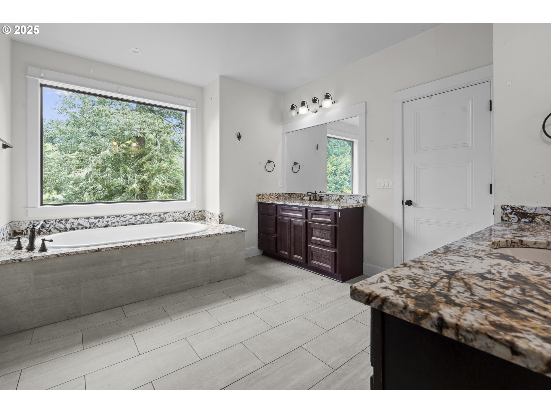 39665 Southeast Rude Road Sandy, OR 97055 - Photo 20 of 48 a bathroom with a tub sink and mirror