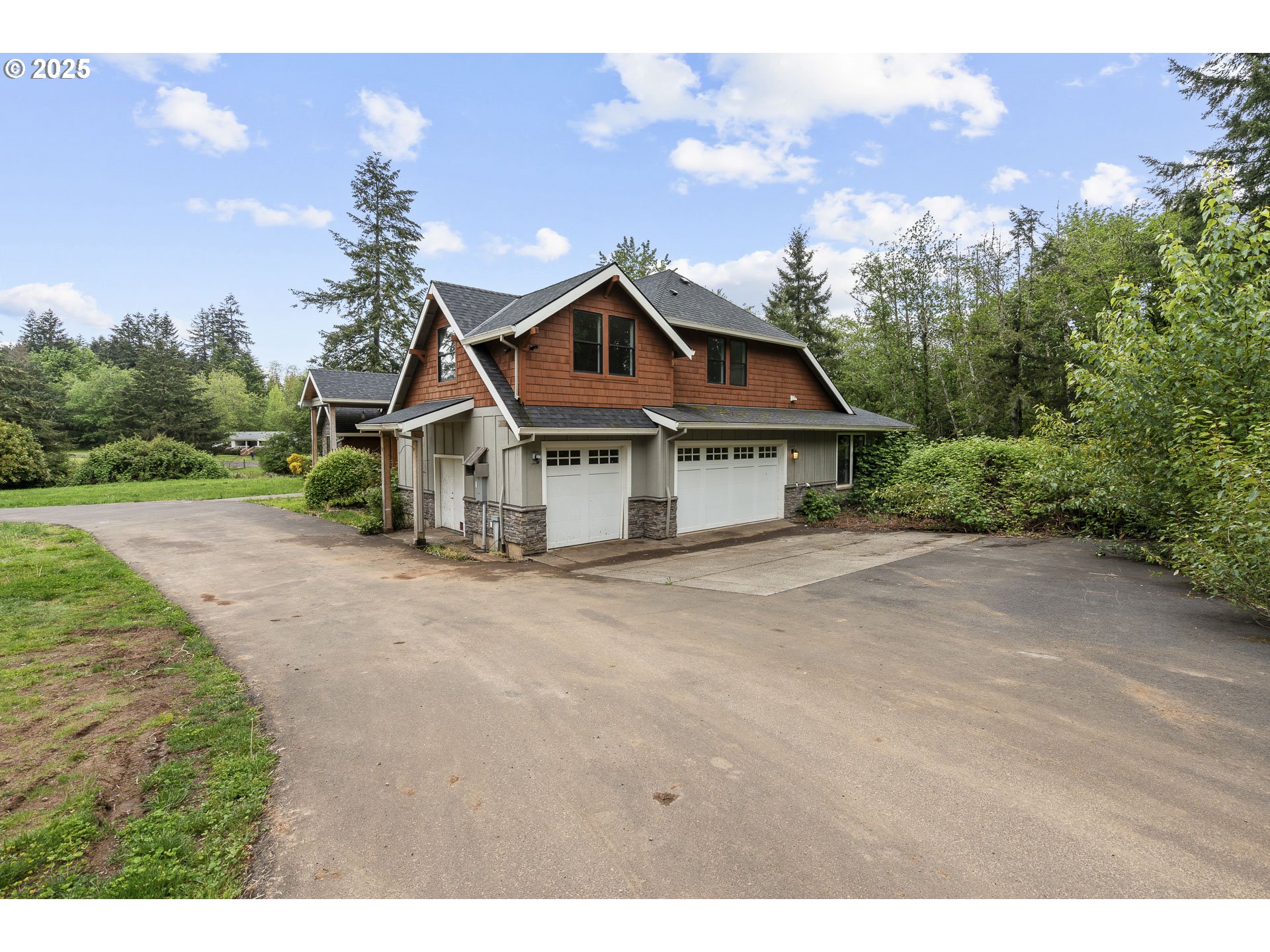 39665 Southeast Rude Road Sandy, OR 97055 - Photo 2 of 48 a house with trees in the background