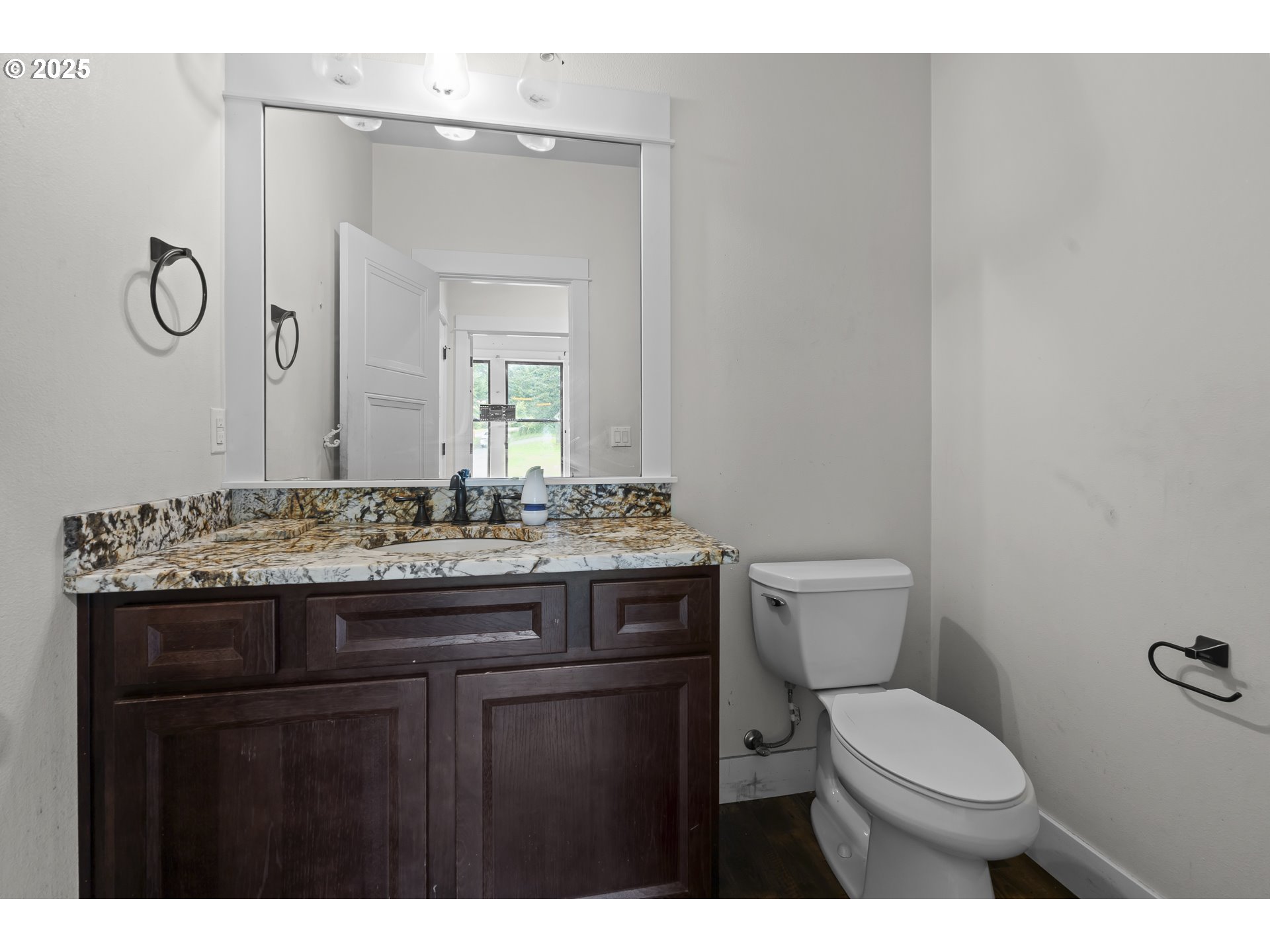 39665 Southeast Rude Road Sandy, OR 97055 - Photo 23 of 48 a bathroom with a granite countertop toilet sink and mirror