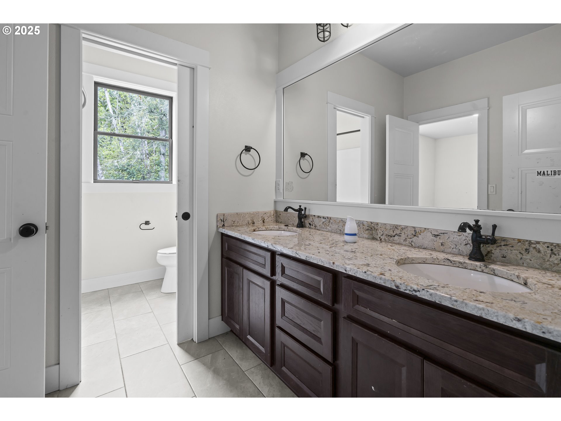 39665 Southeast Rude Road Sandy, OR 97055 - Photo 29 of 48 a bathroom with a granite countertop sink a mirror and a bathtub