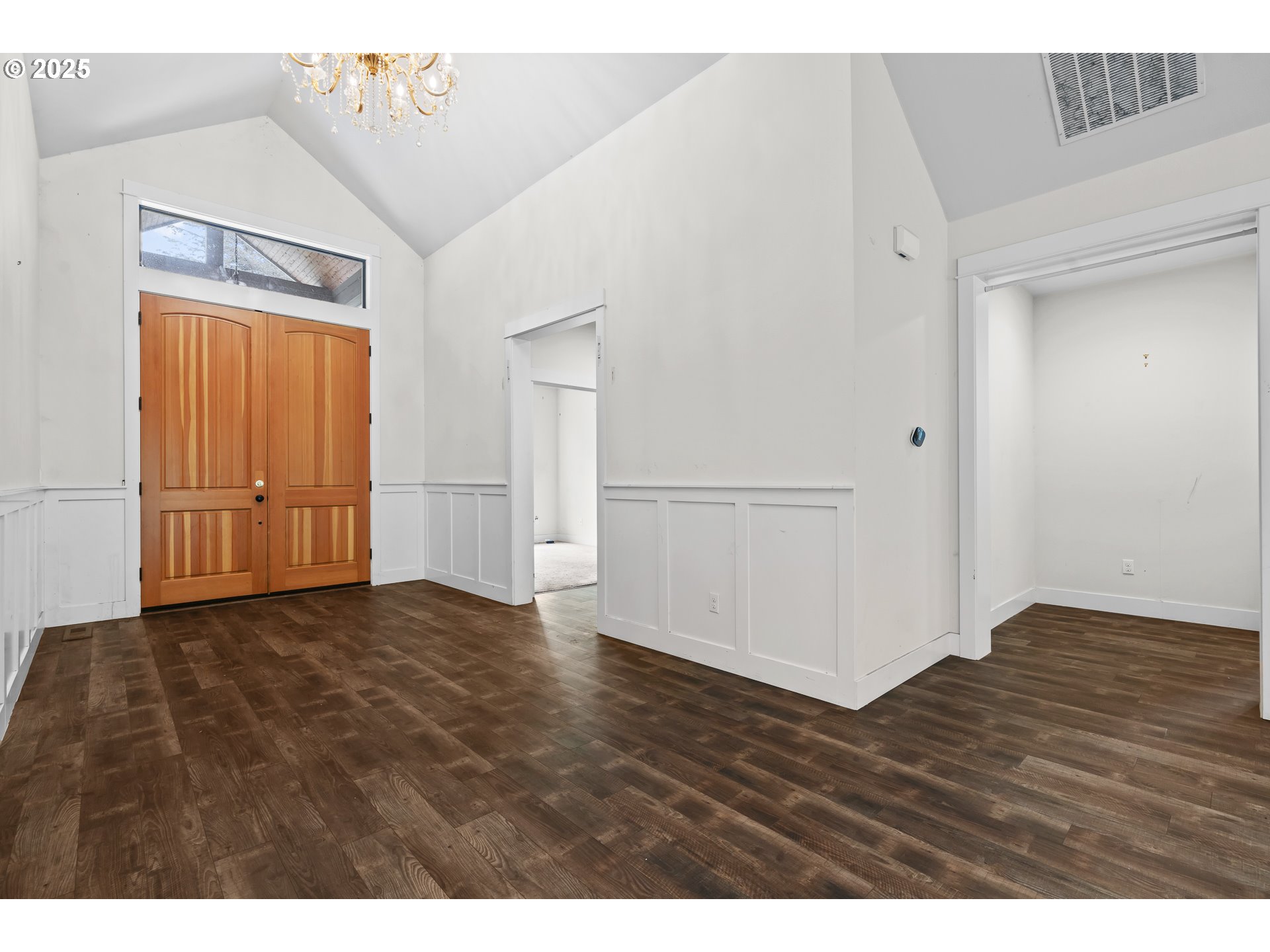 39665 Southeast Rude Road Sandy, OR 97055 - Photo 3 of 48 a view of an empty room with wooden floor
