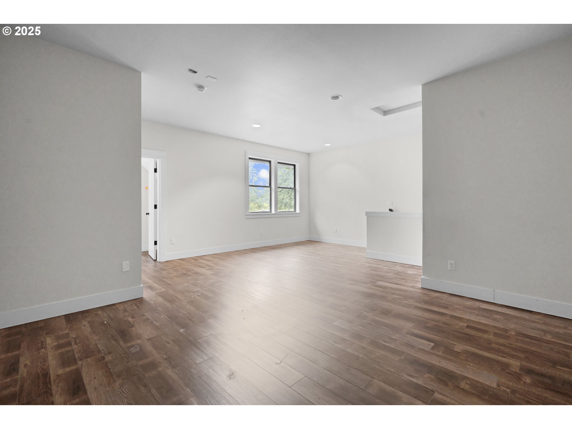 39665 Southeast Rude Road Sandy, OR 97055 - Photo 36 of 48 a view of an empty room with window and wooden floor